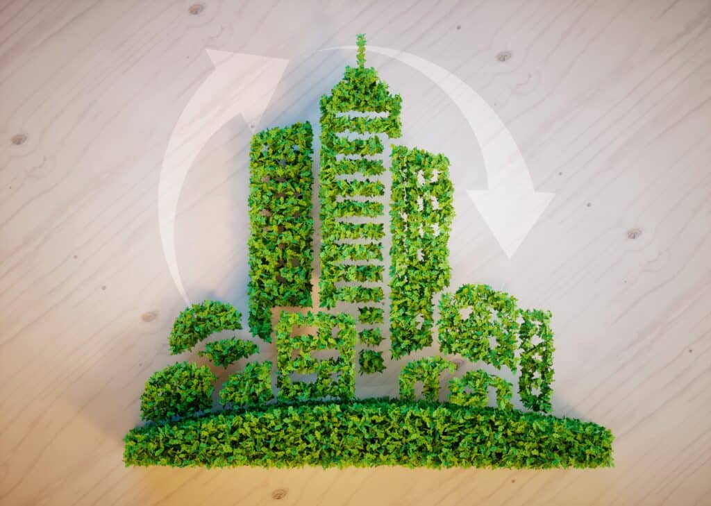 Végétation urbaine représentant un bâtiment et des arbres, illustrant la gestion durable des déchets.